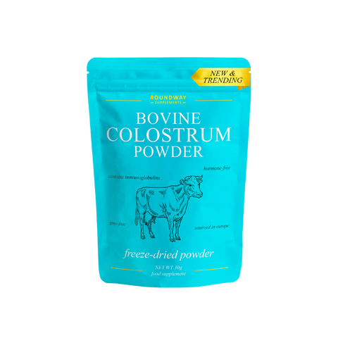 Blue package of Bovine Colostrum Powder with a cow illustration