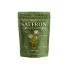 Green package of saffron extract capsules on a white background
